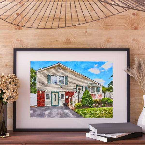 Framed photograph of a house on a wooden wall with decorative elements.