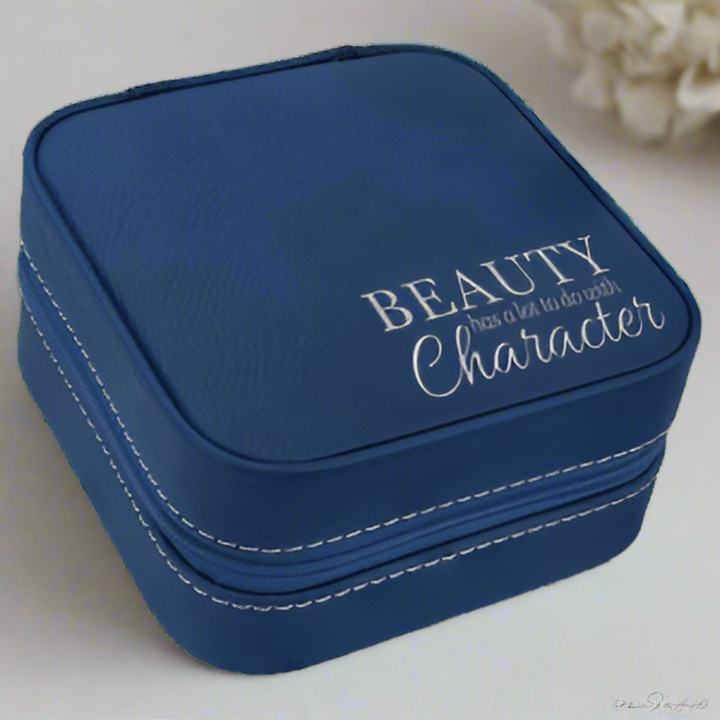 Navy blue jewelry box with 'BEAUTY Character' text on a white background
