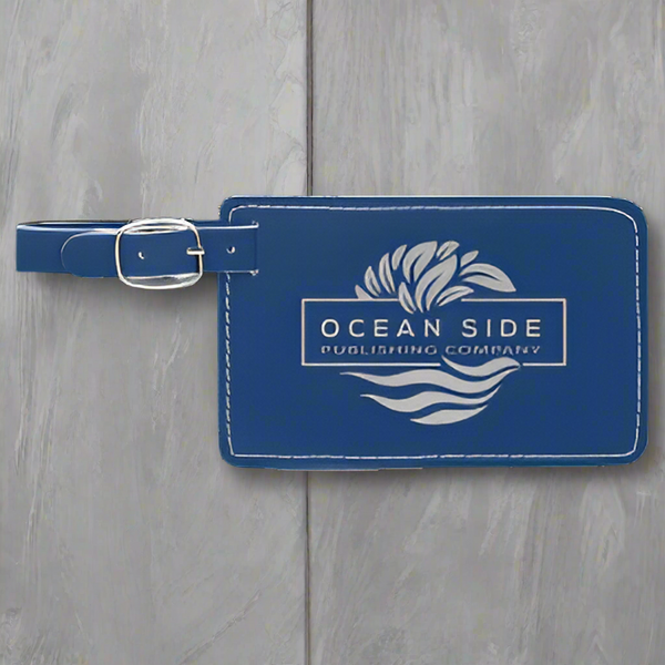 Blue luggage tag with 'Ocean Side Publishing Company' logo on a white background