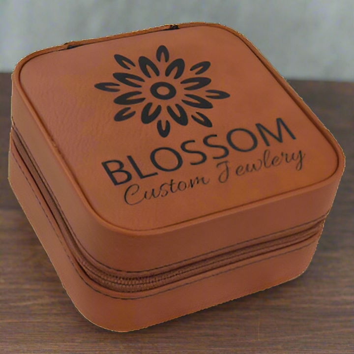Brown jewelry box with 'Blossom Custom Jewelry' logo on a white background