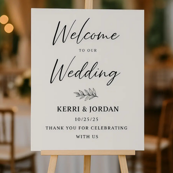 Wedding welcome sign on an easel with blurred wedding reception background